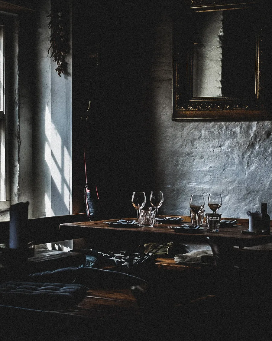 A dark, moody vintage tavern